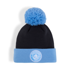 Gorro con pompón Ess del Manchester City de Puma en azul marino y azul claro del equipo